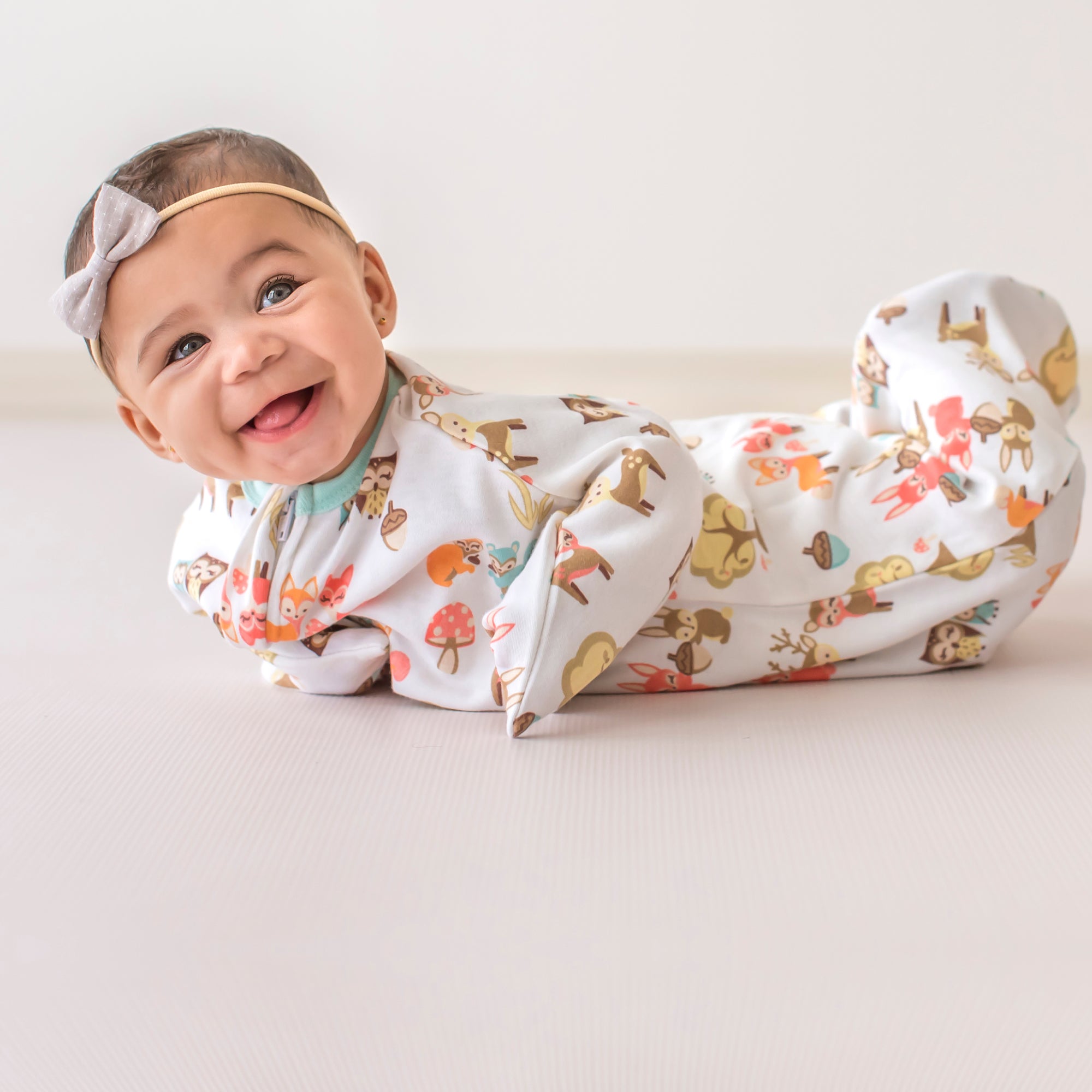 Baby wearing Woodlands animal print Zipadee-Zip
