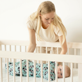 Load image into Gallery viewer, Baby in Penguin fleece Zipadee-Zip in crib