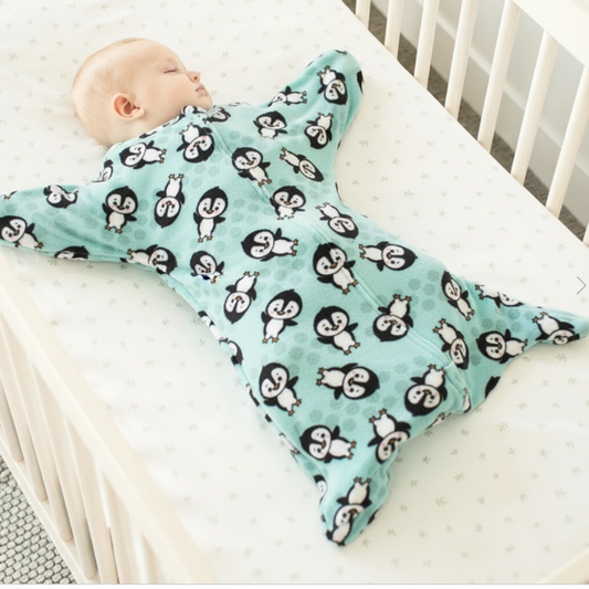 Baby in Penguin fleece Zipadee-Zip with wide starfish arms