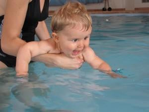 baby learning to swim