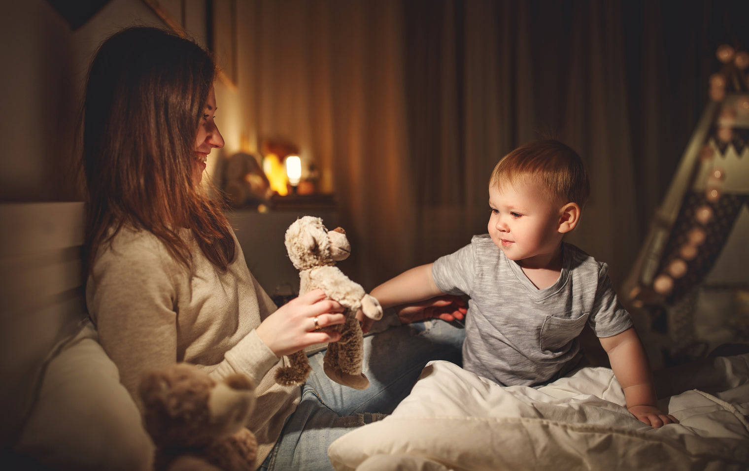 A mother helping their child settle during their bedtime routine