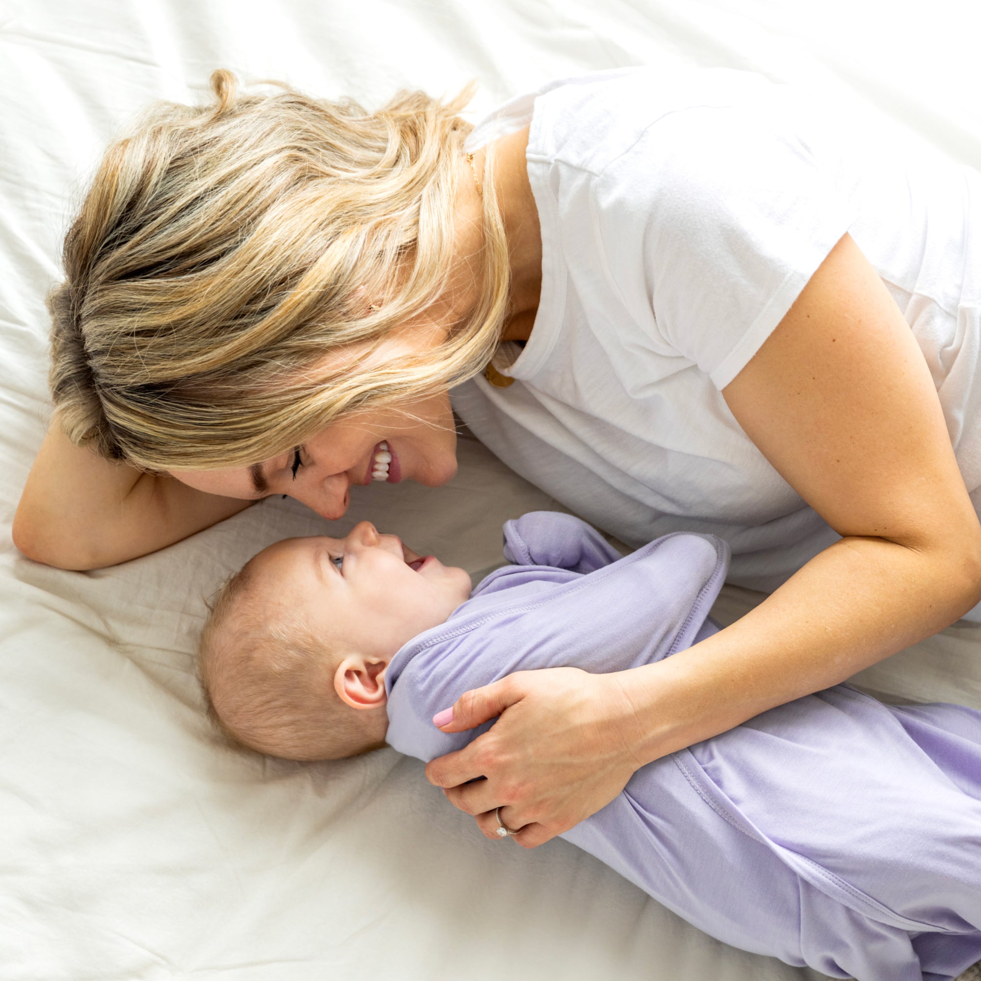 Mom and baby in Lilac bamboo swaddle transition